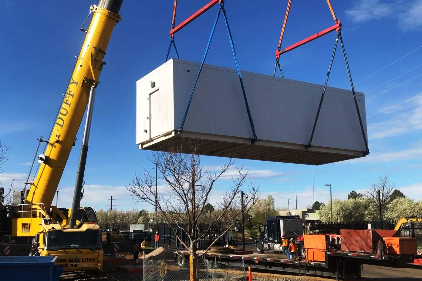 Containerized data center crane lift